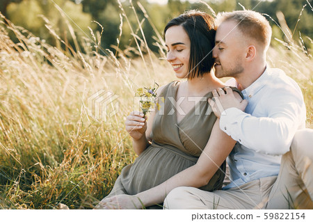 Cute family spending time in a summer field Cute family spending time in a summer field 59822154