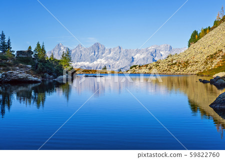 Calm autumn Alps mountain lake with clear 59822760