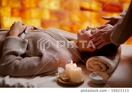 attractive young girl having face massage in spa salon attractive young girl having face massage in spa salon 59823113
