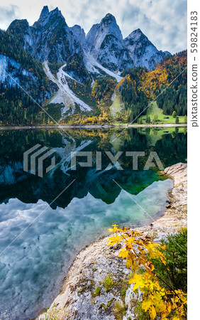Peaceful autumn Alps mountain lake with clear Peaceful autumn Alps mountain lake with clear 59824183