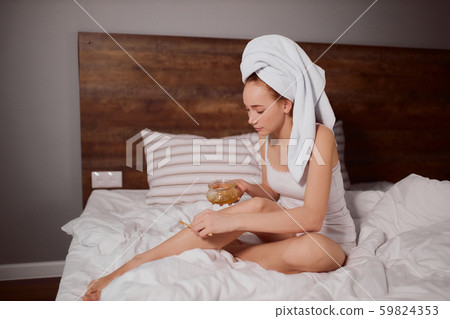 Young lady doing sugaring Young lady doing sugaring 59824353