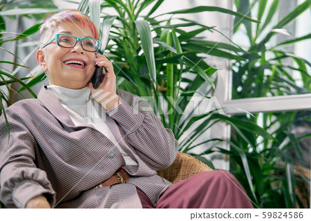 Leisure time of businesswoman after work talking on smartphone Leisure time of businesswoman after work talking on smartphone 59824586
