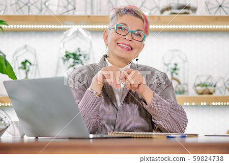 Attractive mature business woman with smiling dreamy look Attractive mature business woman with smiling dreamy look 59824738
