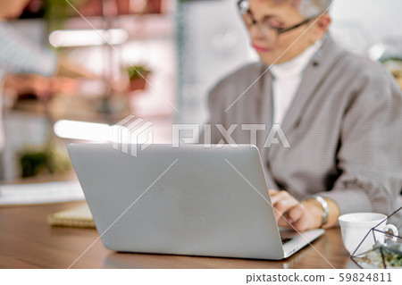 Business woman in glasses with laptop Business woman in glasses with laptop 59824811