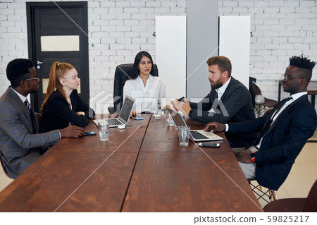 Active discussion of business strategy in meeting office 59825217