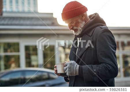 Asking for help. Senior man with grey beard asking for some money help by citizens of city Asking for help. Senior man with grey beard asking for some money help by citizens of city 59826381