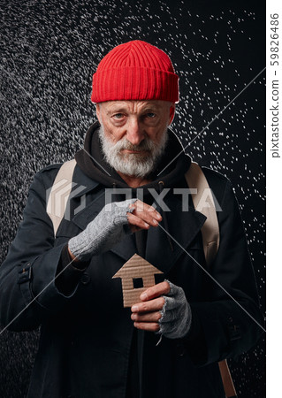Senior beggar male dream about home, shelther standing under rain Senior beggar male dream about home, shelther standing under rain 59826486