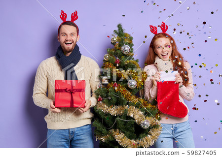 Young couple at christmas party Young couple at christmas party 59827405