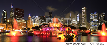 Chicago skyline illuminated at dusk with colorful Buckingham fountain on the foreground Chicago skyline illuminated at dusk with colorful Buckingham fountain on the foreground 59828367