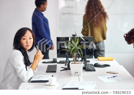 Tired business team working on their project together at office Tired business team working on their project together at office 59829033