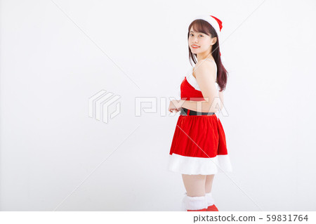 A woman in Santa costume A woman in Santa costume 59831764