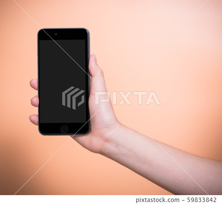 Female holding mobile smartphone plus blank screen 59833842