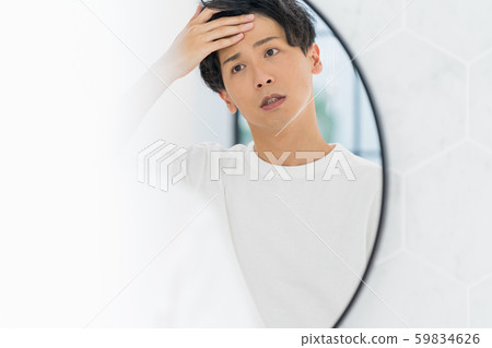 Young man in the toilet 59834626