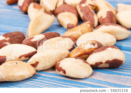Heap of brazil nuts on old boards Heap of brazil nuts on old boards 59835158