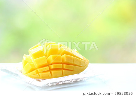 Mango yellow seed cut nature background 59838056