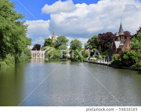 Bruges, Belgium, Forest and Church of Our Lady over the canal Bruges, Belgium, Forest and Church of Our Lady over the canal 59838165