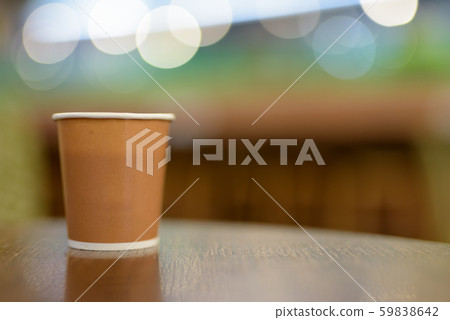 Hot Coffee In Paper Cup Placed On Wooden Table 59838642