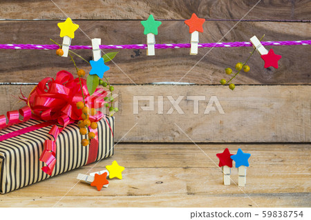 gift box for special day in festival day with colorful clips star wooden hang pink rope 59838754