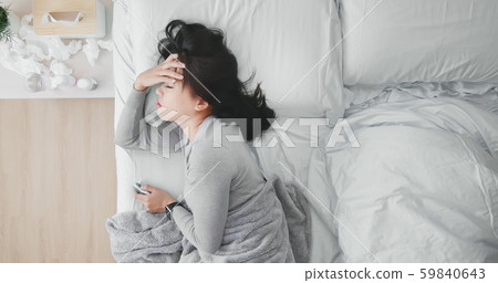 woman sick and has fever 59840643
