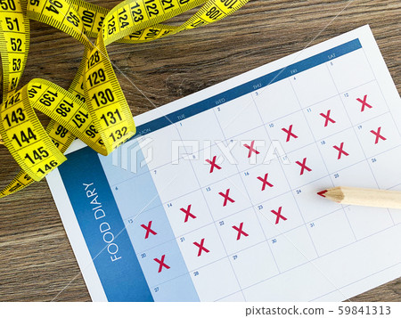 Diet plan concept. Measuring tape and diet plan on wooden background. Diet plan concept. Measuring tape and diet plan on wooden background. 59841313