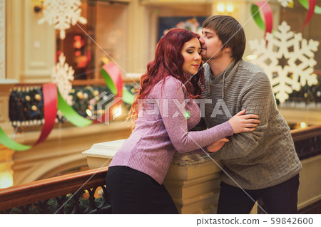 Lovers walk at the christmas market 59842600
