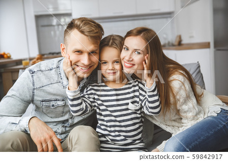 Family at home together leisure love concept smiling 59842917