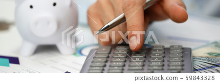 Male hand push key silver calculator is lying Male hand push key silver calculator is lying 59843328