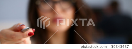 Female arm in suit hold silver pen and pad Female arm in suit hold silver pen and pad 59843487