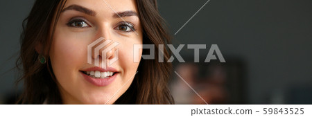 Beautiful smiling girl at workplace look in camera Beautiful smiling girl at workplace look in camera 59843525