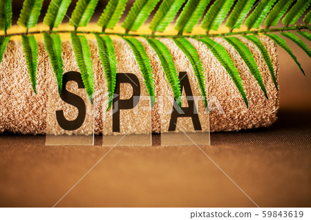 Chocolate Spa . Composition brown towel in hotel room of spa treatment 59843619