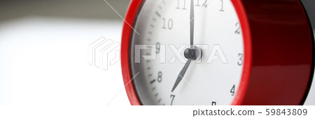 Red alarm clock set at seven in the morning Red alarm clock set at seven in the morning 59843809