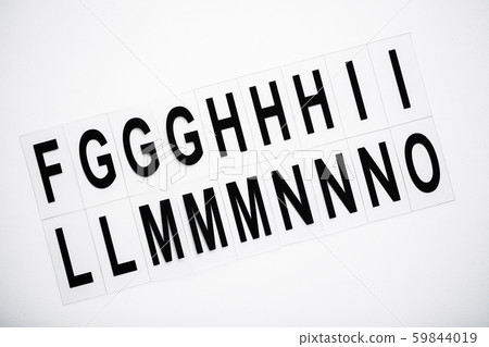 Black capitalize letter on white table background. 59844019