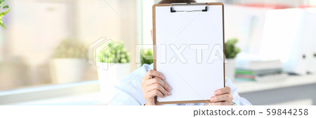 Businessman holds clipboard with paper Businessman holds clipboard with paper 59844258