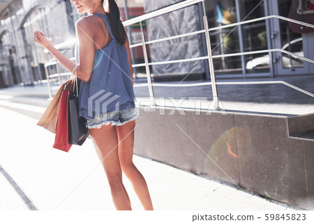 Attractive cute girl in with the bags enjoying in shopping. Favorite activity of all women 59845823