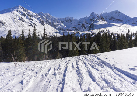 Big snow-capped peaks of the Tatra Mountains on a Big snow-capped peaks of the Tatra Mountains on a 59846149