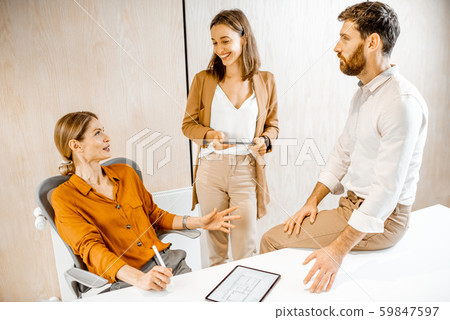 Informal conversation in the office 59847597