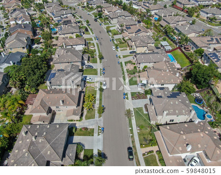 Suburban neighborhood street with big villas Suburban neighborhood street with big villas 59848015
