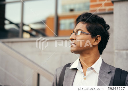 Young handsome Indian man in an office suit and white shirt Young handsome Indian man in an office suit and white shirt 59848227