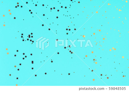 Golden stars glitter confetti on blue background. Festive backdrop. Golden stars glitter confetti on blue background. Festive backdrop. 59848505