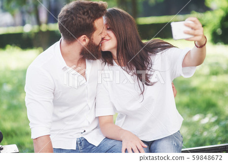 Romantic couple enyojing in moments of happiness in the park. Lifestyle concept love and tenderness 59848672