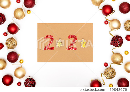 2020 made of red sparkles and decorative golden christmas trees on craft paper. Frame from christmas 59848676