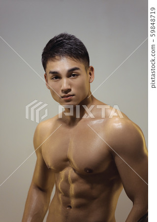 Muscular Asian Man Indoors in th Studio 59848719