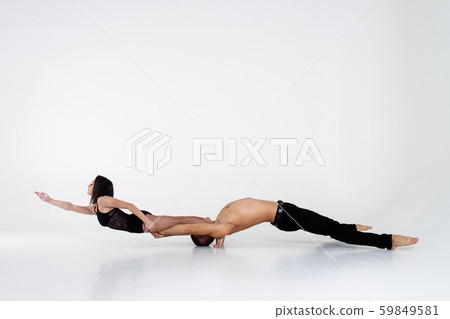 Duo Of Acrobats Showing Trick, Isolated On White 59849581