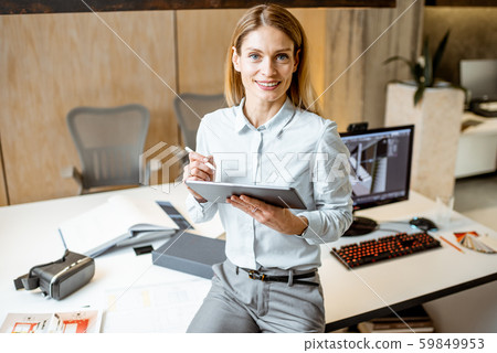 Portrait of a woman with tablet in the office 59849953