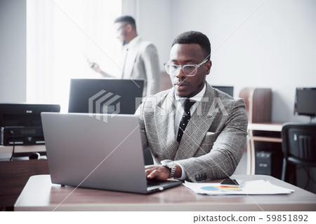 Two handsome cheerful african american executive business man at the workspace office 59851892