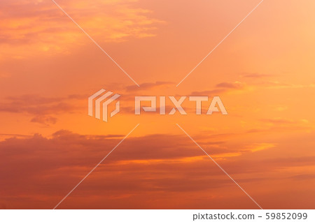 Abstract nature background. Dramatic sunset sky in the clouds saturated with bright colors of orange Abstract nature background. Dramatic sunset sky in the clouds saturated with bright colors of orange 59852099