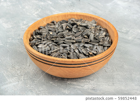 Sunflower seeds in bowl 59852448