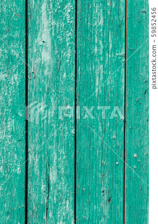 Old and peeling paint Over time, the green paint peeled off from the old boards and the wood texture Old and peeling paint Over time, the green paint peeled off from the old boards and the wood texture 59852456