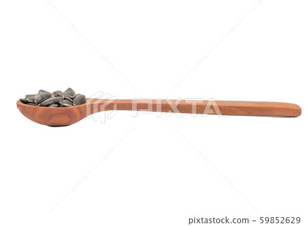 Sunflower seeds in a spoon 59852629