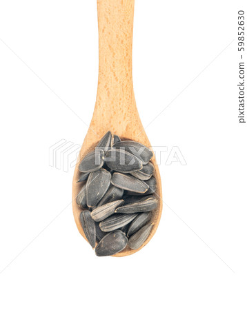 Sunflower seeds in a spoon Sunflower seeds in a spoon 59852630